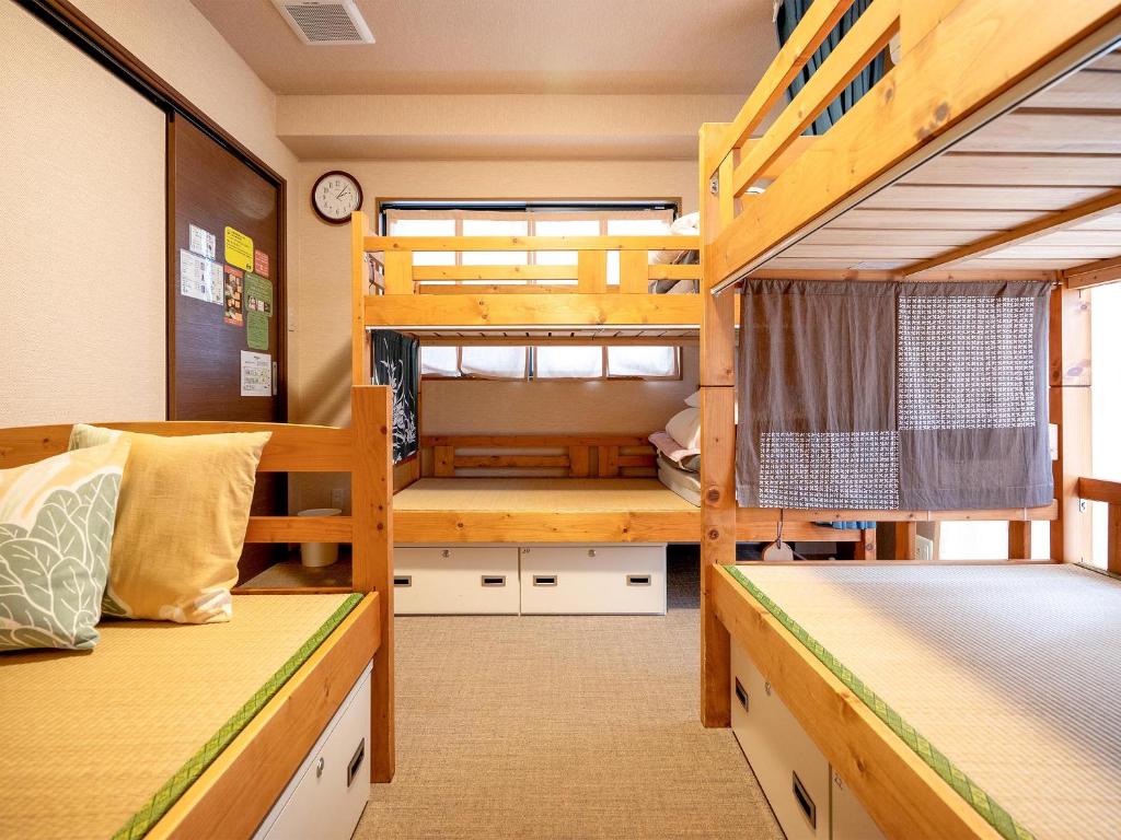 Postel nebo postele na pokoji v ubytování Guest House Nakaima