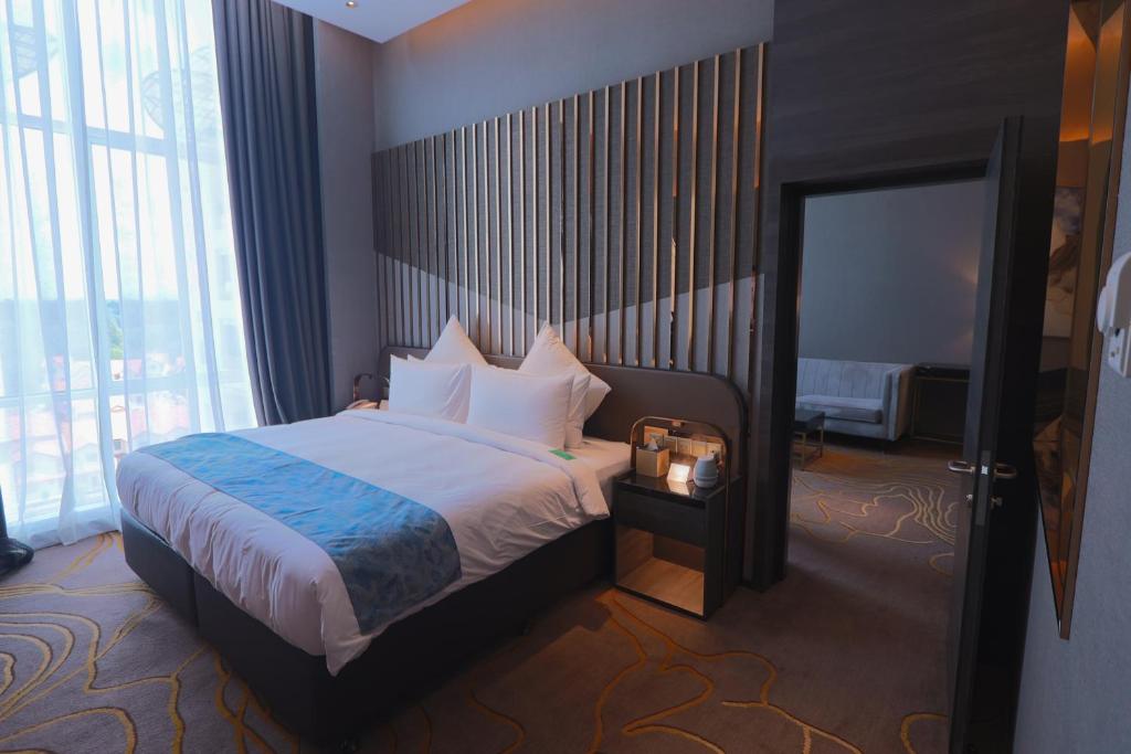 Postel nebo postele na pokoji v ubytování Ames Hotel