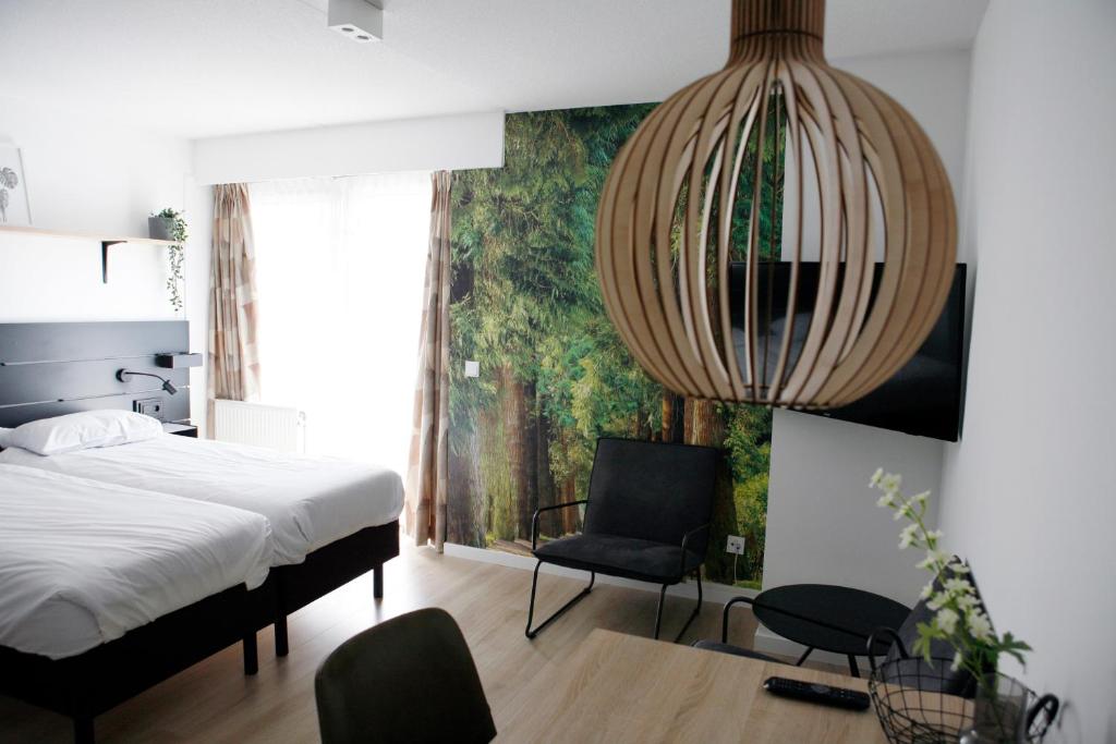 Postel nebo postele na pokoji v ubytování Hotel & Appartementen - De Zeven Heuvelen