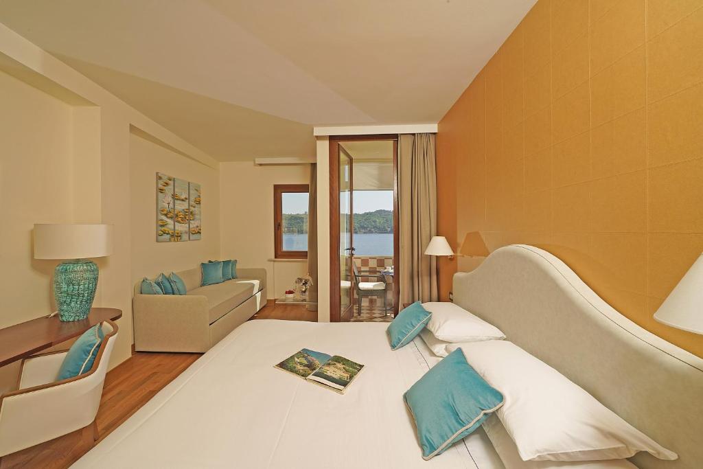 Postel nebo postele na pokoji v ubytování Hotel Vigna