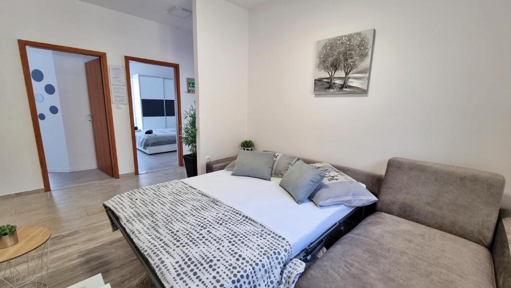 Posteľ alebo postele v izbe v ubytovaní Apartment Milana