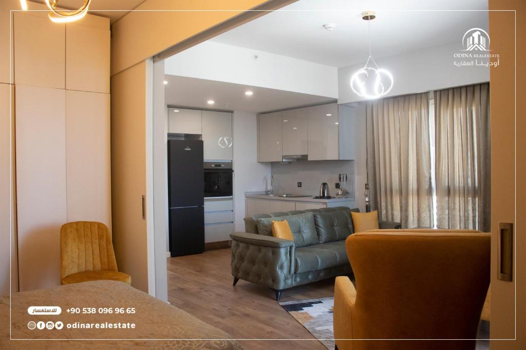 a living room with a couch and a kitchen at luxury holiday in the heart of istanbul in Istanbul