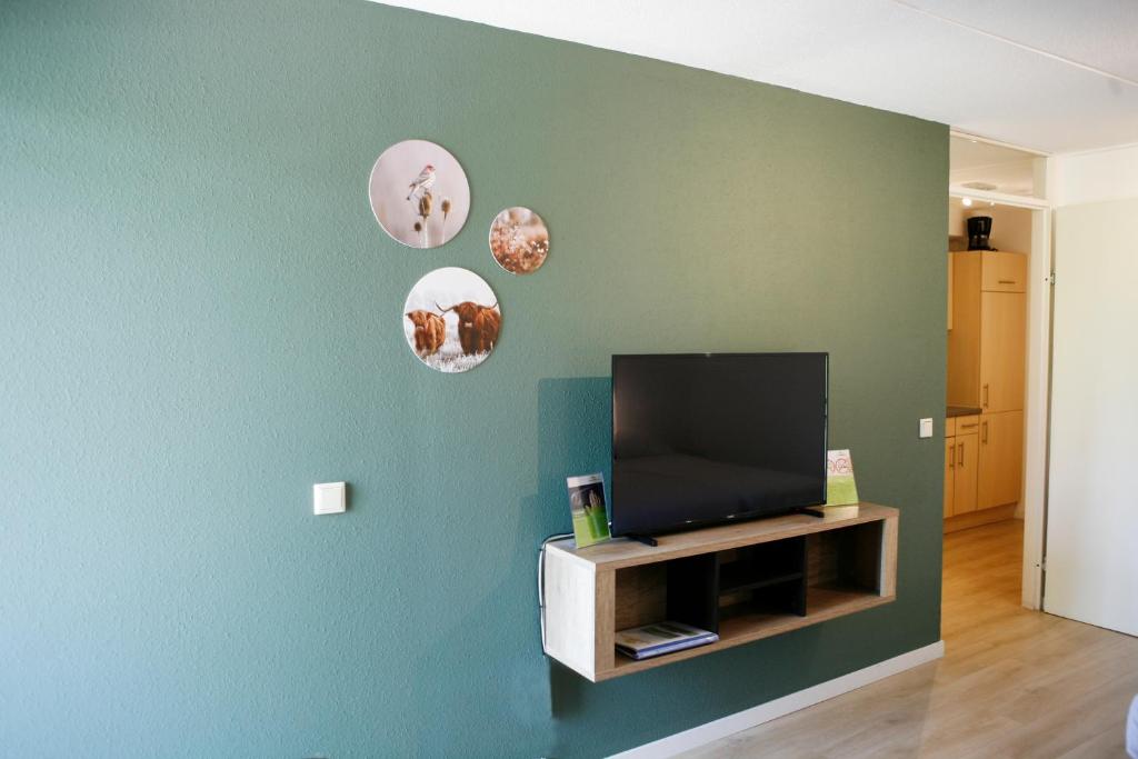 TV a/nebo společenská místnost v ubytování Hotel & Appartementen - De Zeven Heuvelen