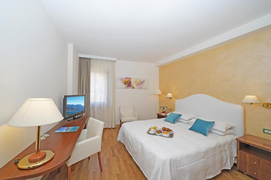 Postel nebo postele na pokoji v ubytování Hotel Vigna