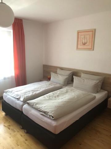 Postel nebo postele na pokoji v ubytování Hotel am Brünnchen