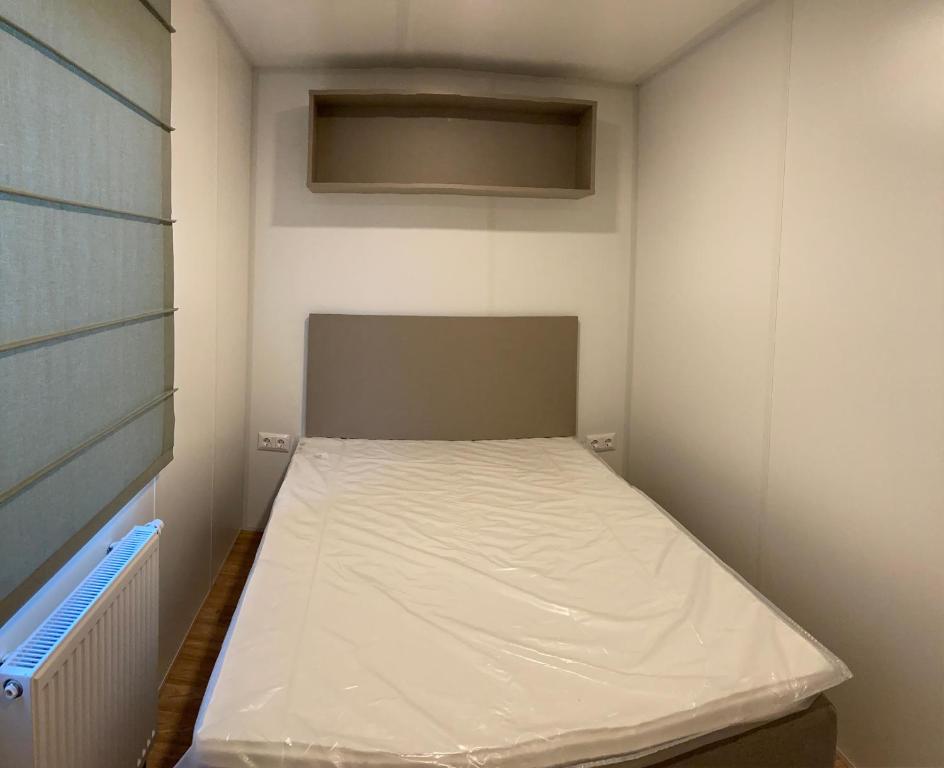 Postel nebo postele na pokoji v ubytování Vakantiepark duinzicht
