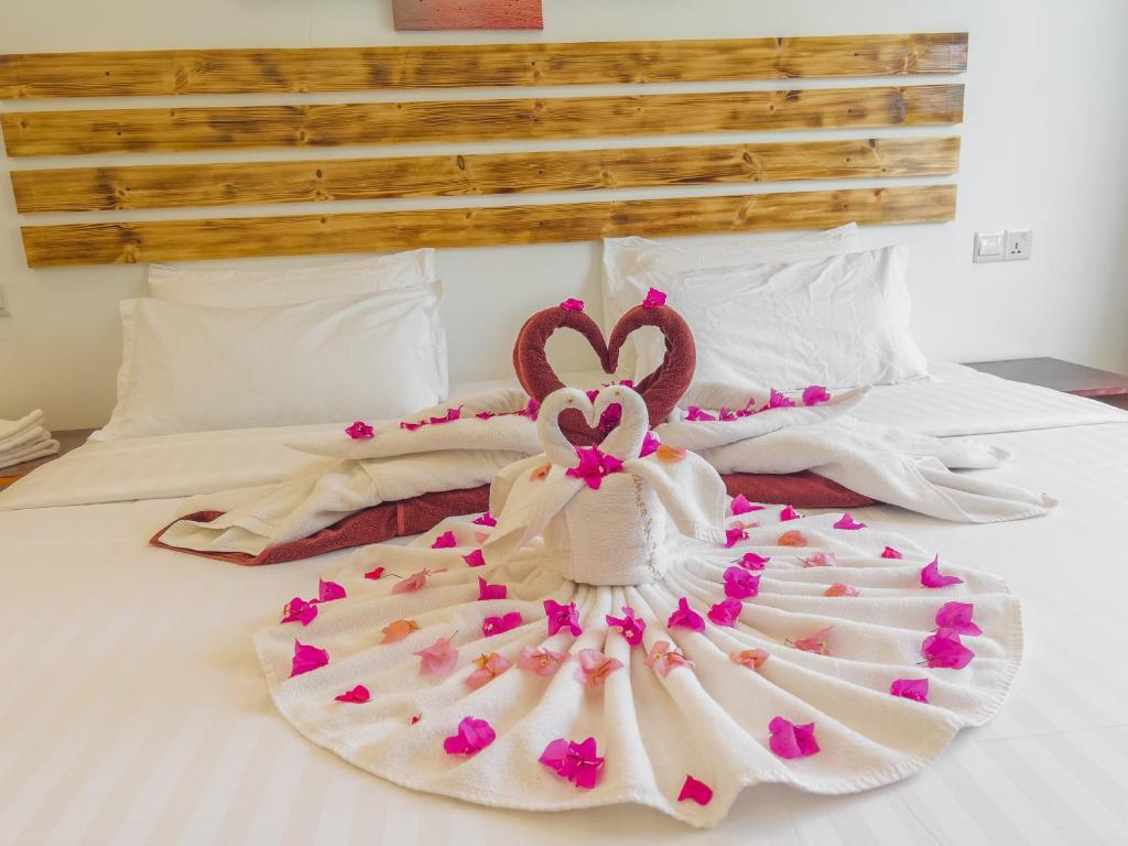 Postel nebo postele na pokoji v ubytování Summer inn Thoddoo