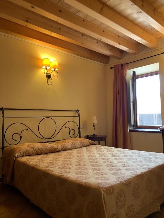 Postel nebo postele na pokoji v ubytování Seiterre Agriturismo Tenuta San Leone