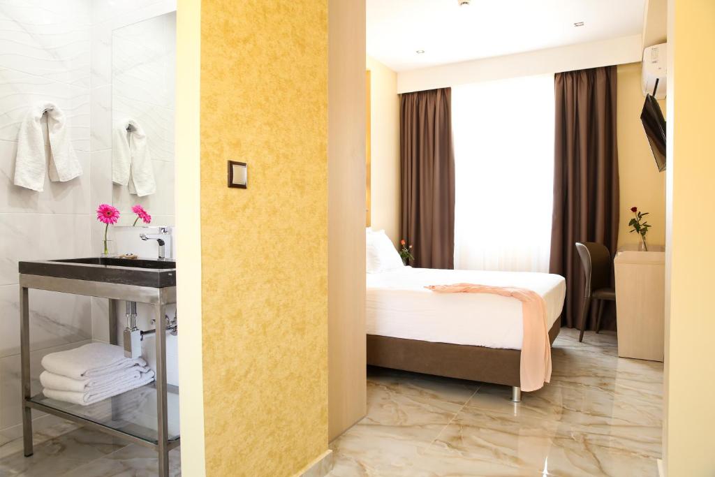 Letto o letti in una camera di Athens Starlight Hotel