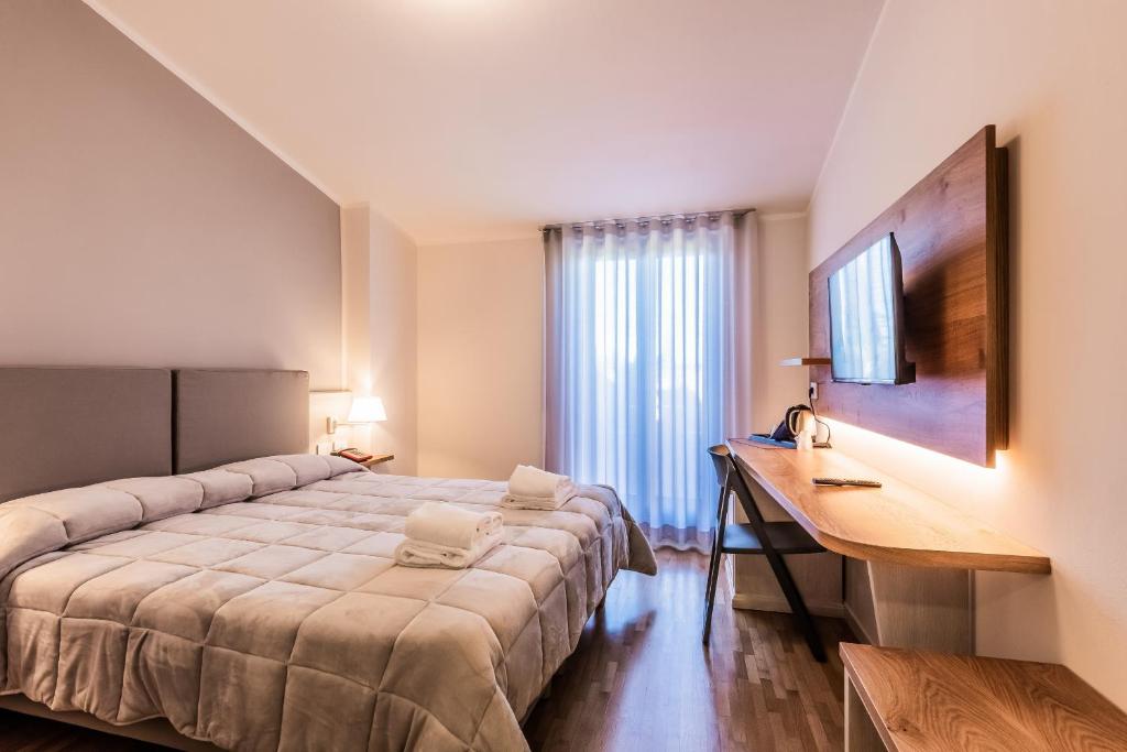 Postel nebo postele na pokoji v ubytování Hotel Palazzuolo
