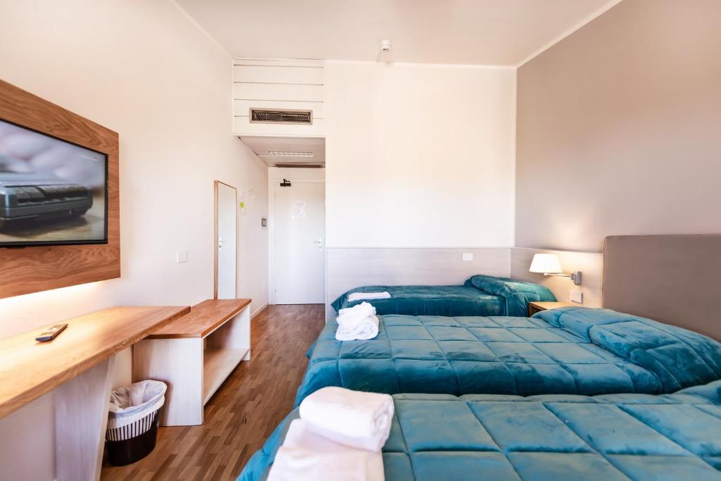 Postel nebo postele na pokoji v ubytování Hotel Palazzuolo