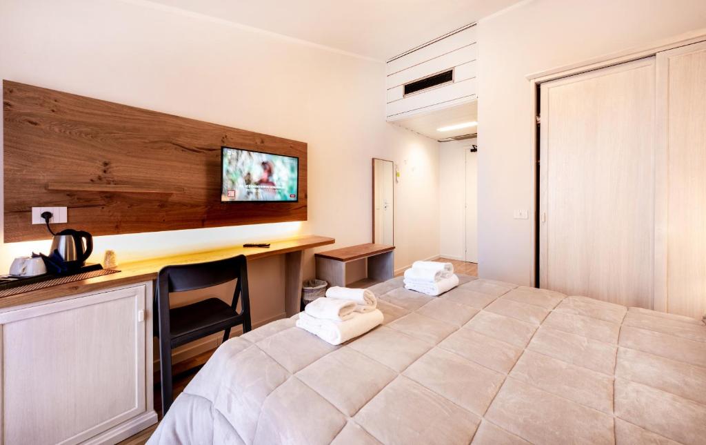 Postel nebo postele na pokoji v ubytování Hotel Palazzuolo