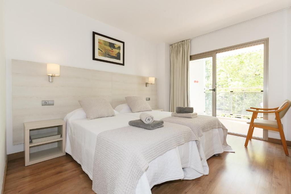 Posteľ alebo postele v izbe v ubytovaní UHC Michelangelo Apartments