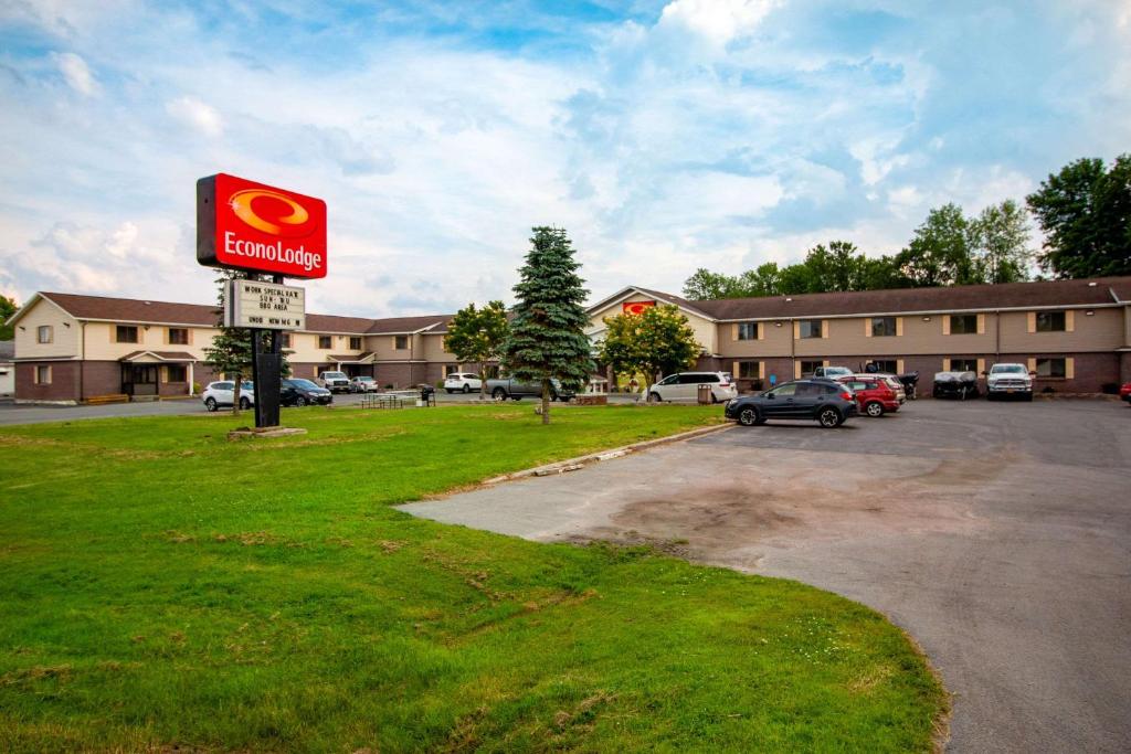 a sign for a hotel in a parking lot at Econo Lodge Massena Hwy 37 in Massena