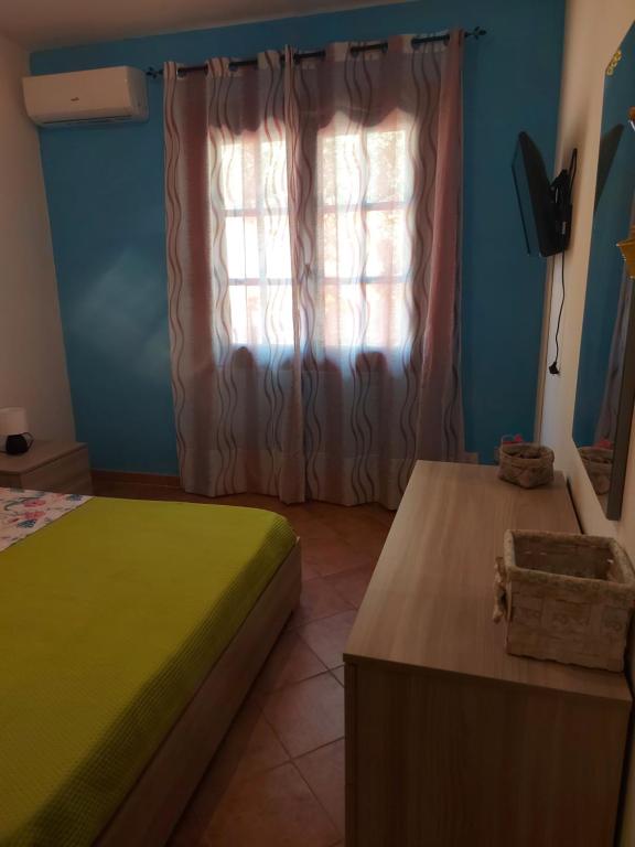 Postel nebo postele na pokoji v ubytování Paraiso Sardo 1