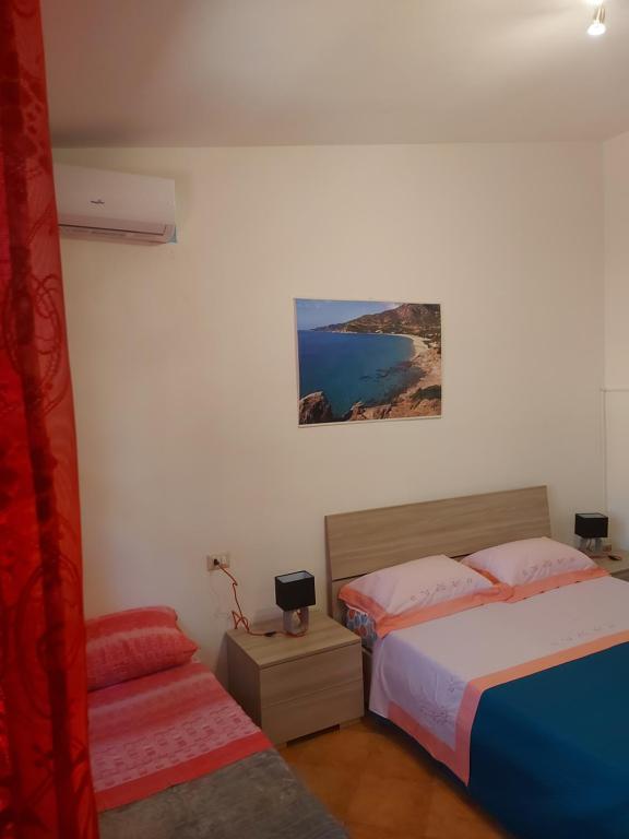 Postel nebo postele na pokoji v ubytování Paraiso Sardo 1