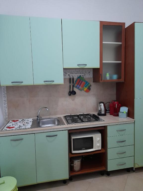 Kuchyňa alebo kuchynka v ubytovaní Domus Rosaliae - Casa Vacanze
