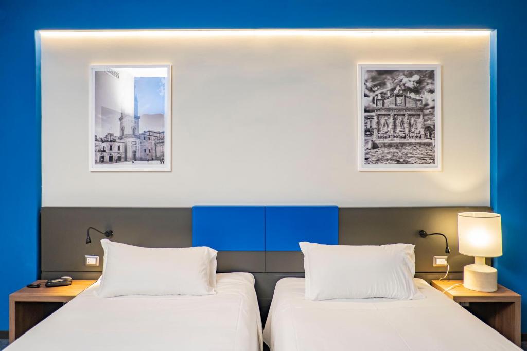 Postel nebo postele na pokoji v ubytování Mercure Hotel President Lecce