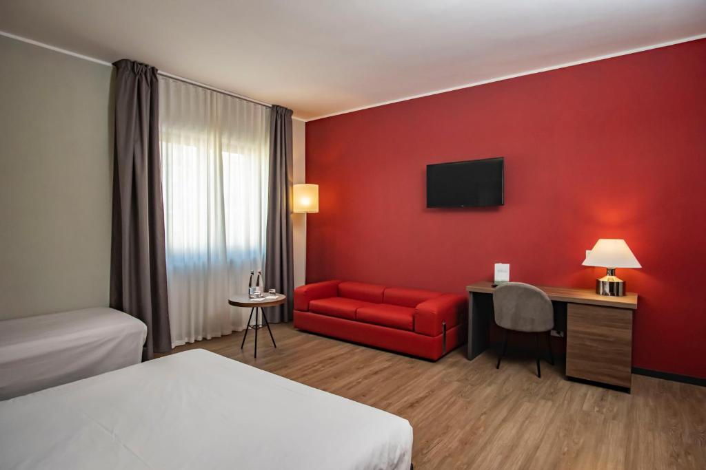 Postel nebo postele na pokoji v ubytování Mercure Hotel President Lecce