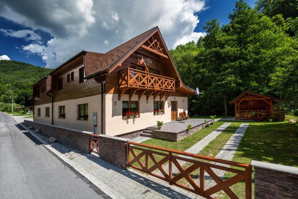 a house on the side of a road at Penzion Hastrman in Banská Bystrica