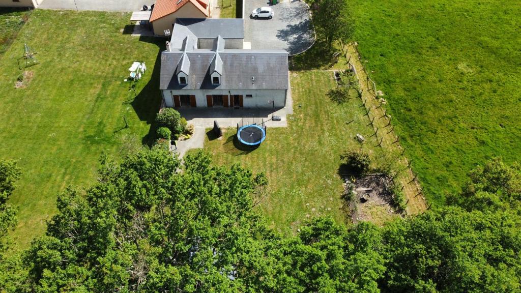an aerial view of a house in a field at Maison 6 chambres au cœur du circuit des 24h du Mans in Mulsanne