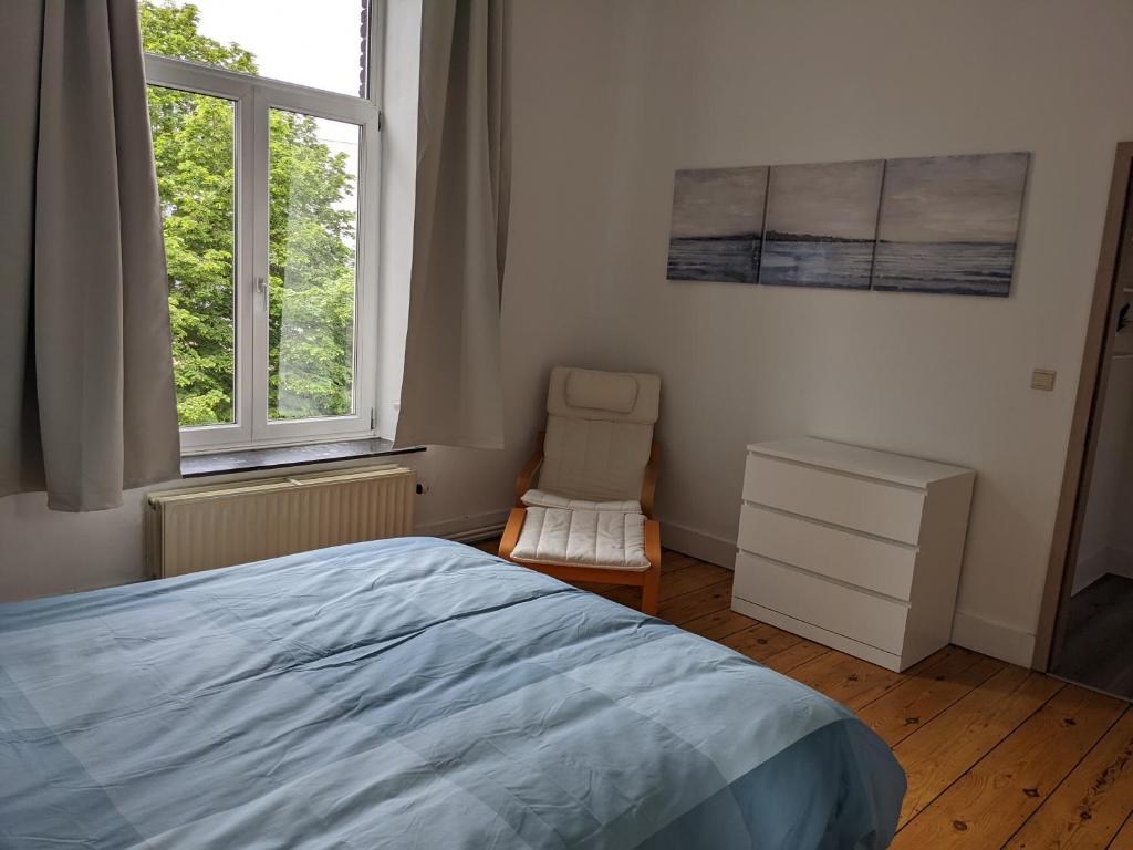 Postel nebo postele na pokoji v ubytování Appart'Huy