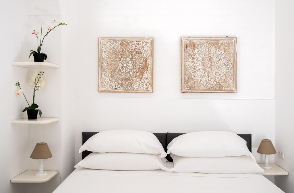 Postel nebo postele na pokoji v ubytování Capri Town Apartments