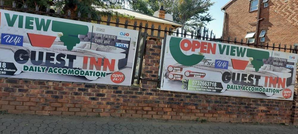a brick wall with election signs on it at Open View Guest Inn in Kempton Park