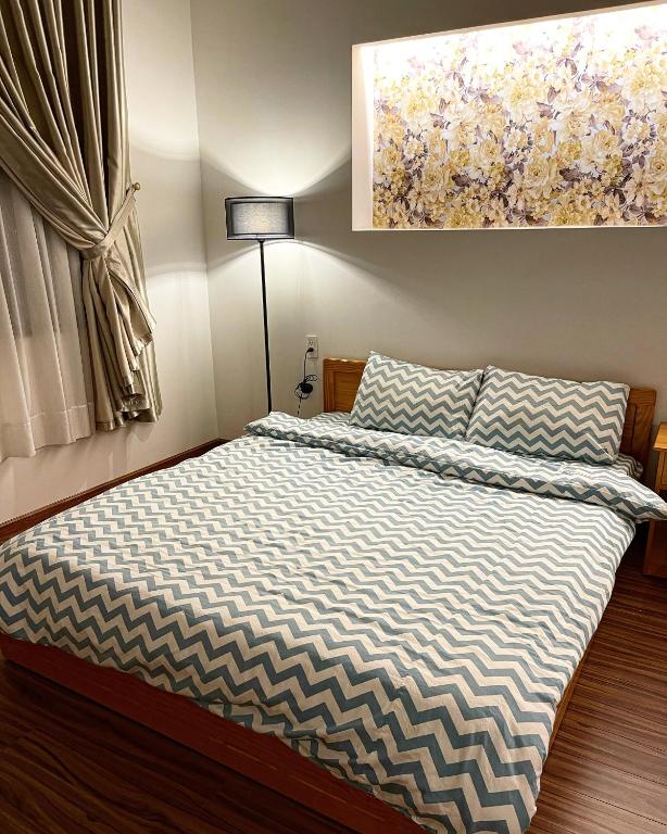 Postel nebo postele na pokoji v ubytování Tuan Long Da Lat Hostel
