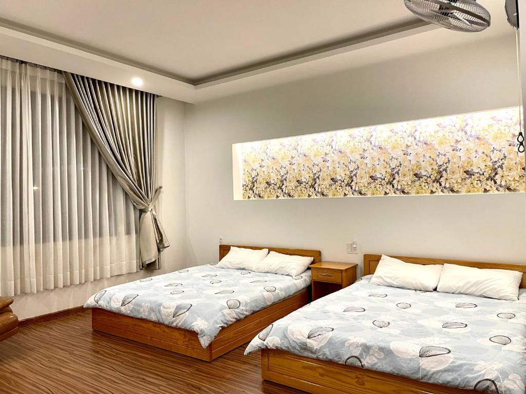 Postel nebo postele na pokoji v ubytování Tuan Long Da Lat Hostel
