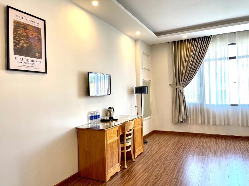 TV a/nebo společenská místnost v ubytování Tuan Long Da Lat Hostel
