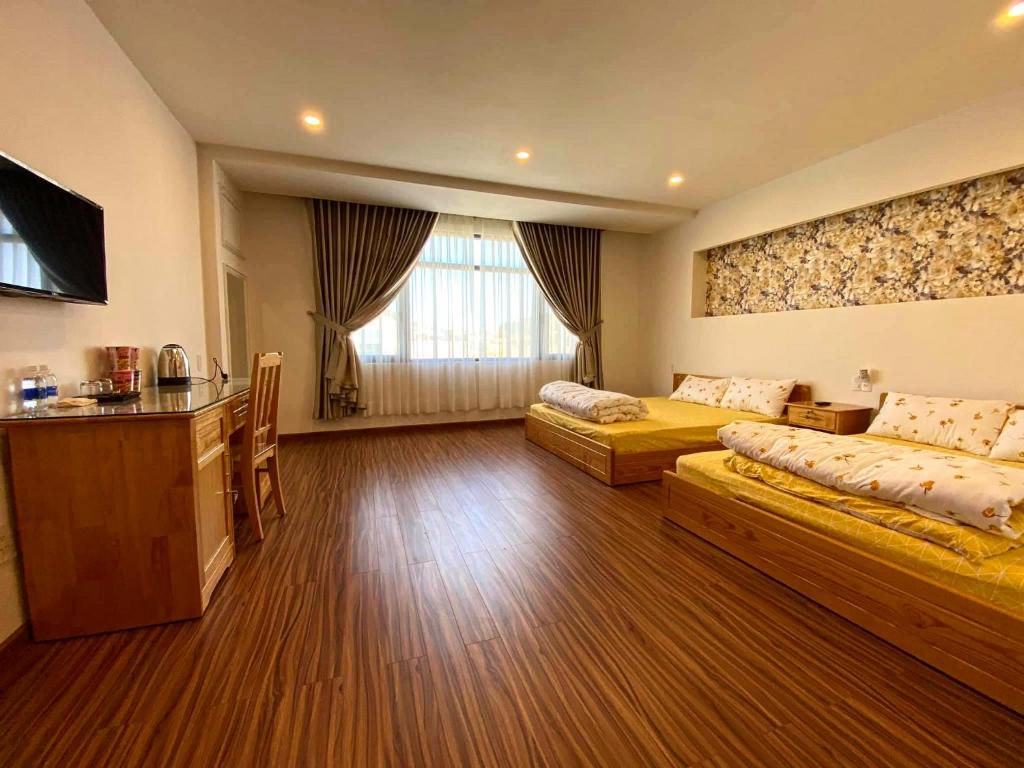 Postel nebo postele na pokoji v ubytování Tuan Long Da Lat Hostel