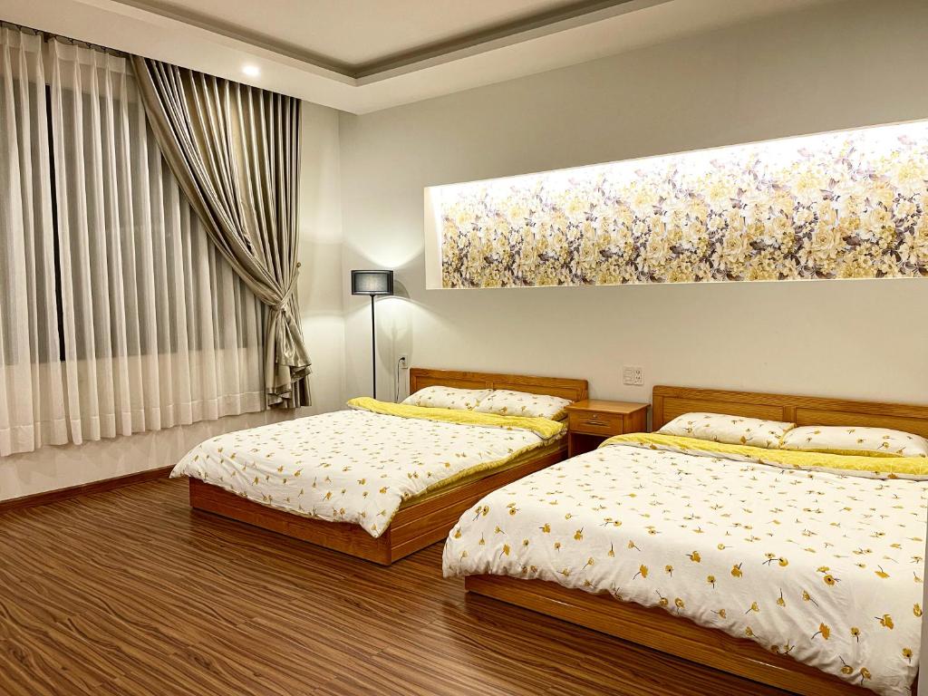 Postel nebo postele na pokoji v ubytování Tuan Long Da Lat Hostel