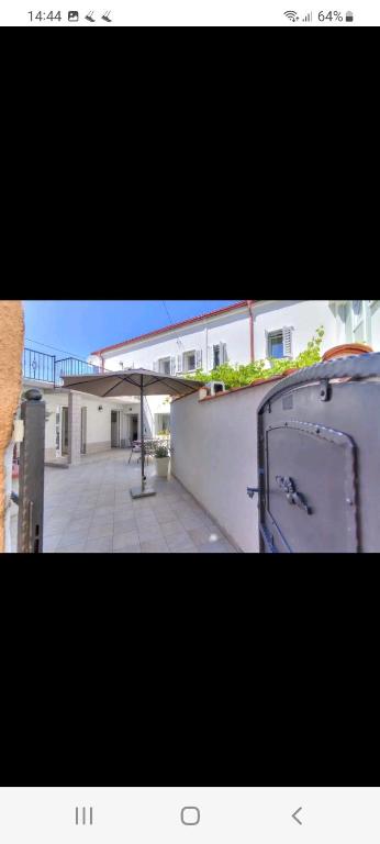 a picture of a building with a door in front of it at Casa Lanamaria in Novi Vinodolski