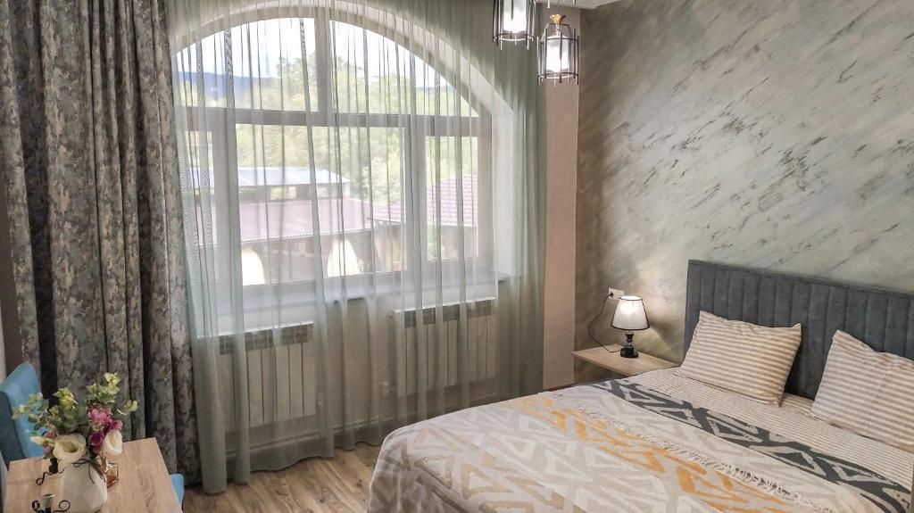 Postel nebo postele na pokoji v ubytování Harmonia Garden GastroYard&Hotel