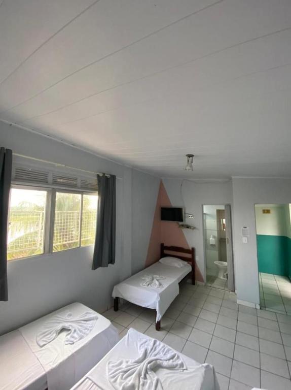 Postel nebo postele na pokoji v ubytování Pousada Vila do Penedo