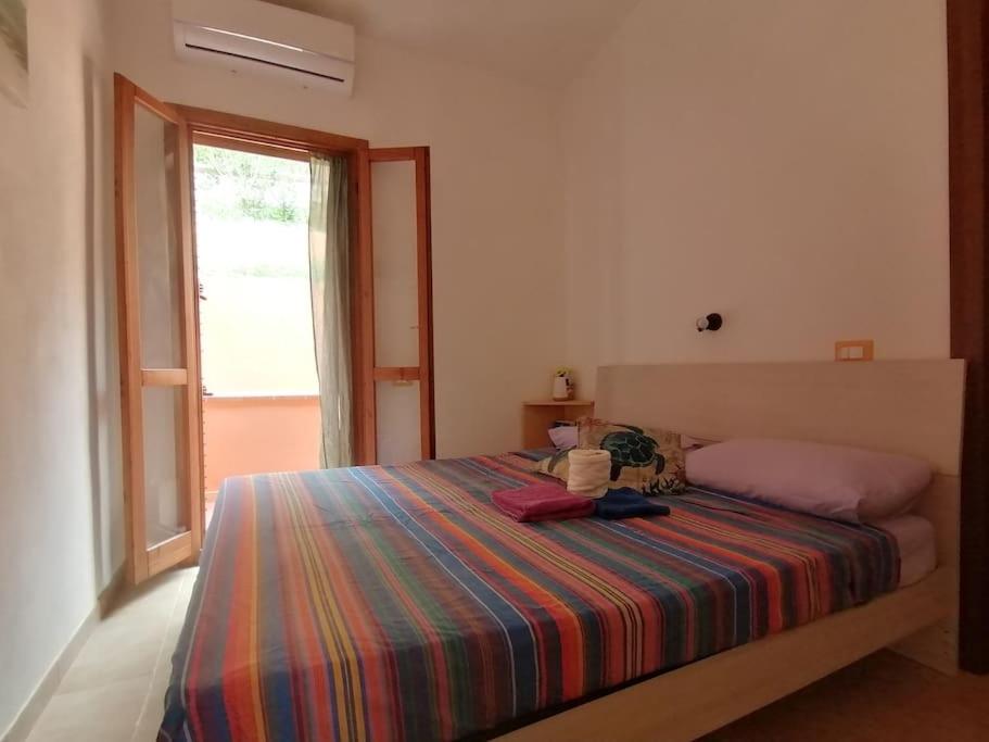 Un ou plusieurs lits dans un hébergement de l'établissement Residenza Mirto