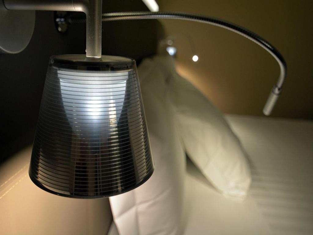 Posteľ alebo postele v izbe v ubytovaní Quirinale Luxury Rooms