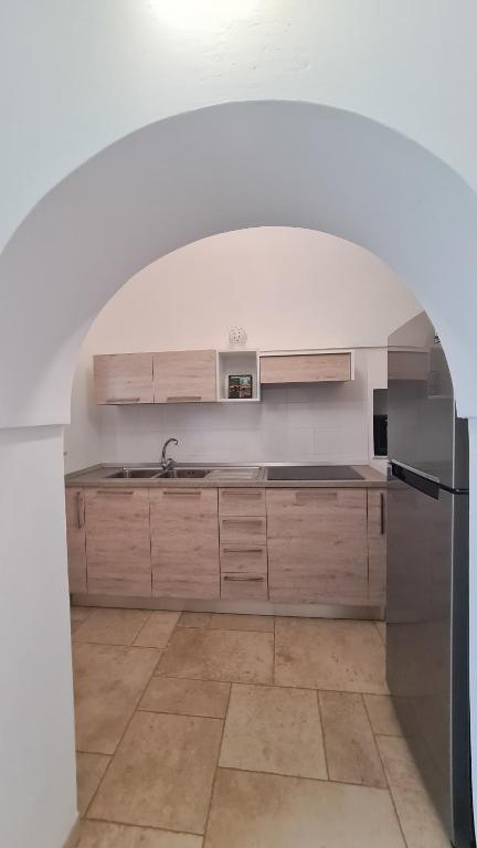 Kuchyňa alebo kuchynka v ubytovaní I Trulli di Mina - Trullo Girasole