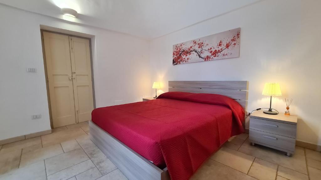 Posteľ alebo postele v izbe v ubytovaní I Trulli di Mina - Trullo Girasole