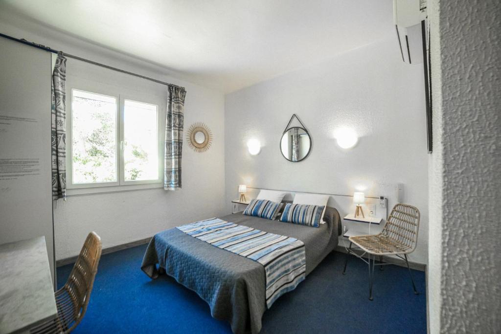 Ein Bett oder Betten in einem Zimmer der Unterkunft Le Fanal