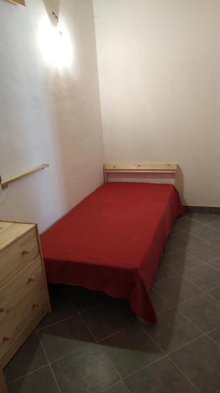 Łóżko lub łóżka w pokoju w obiekcie LA Casina di Anna