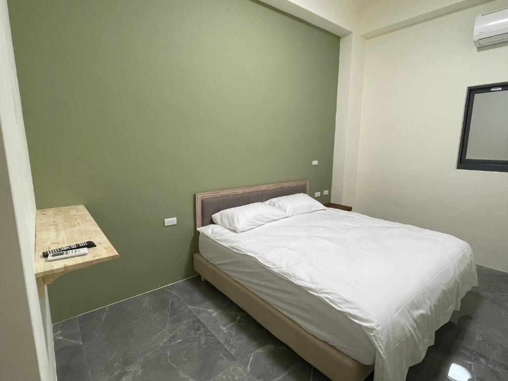 Postel nebo postele na pokoji v ubytování Mu Zhu Yuan