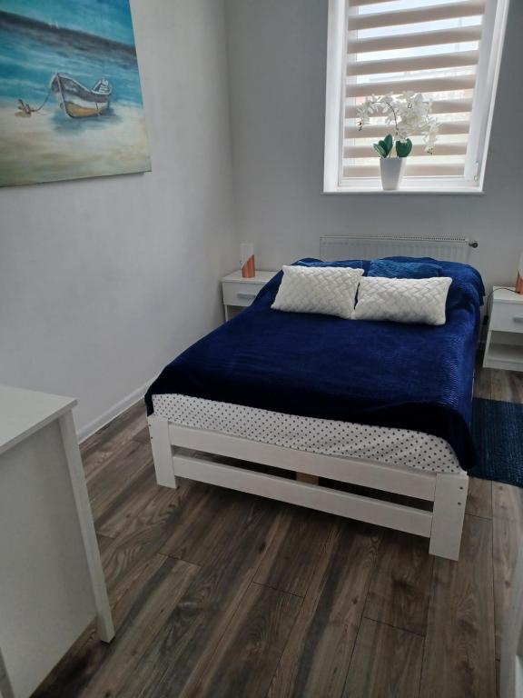 Posteľ alebo postele v izbe v ubytovaní Mieszkanie przy Molo