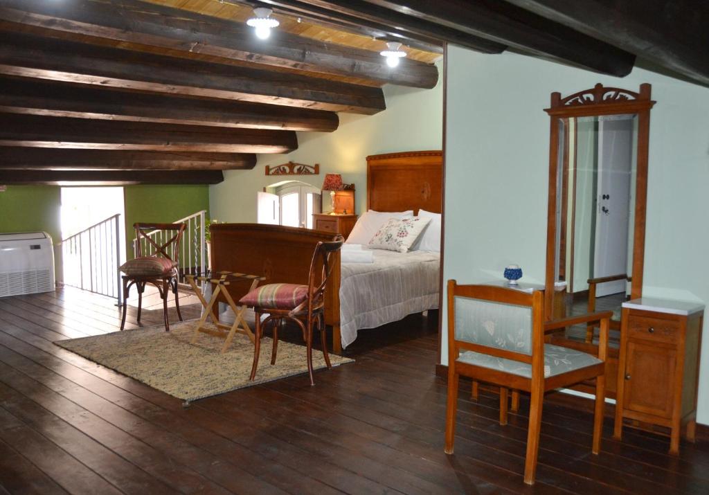 Postel nebo postele na pokoji v ubytování SUD room Palazzo Rau della Ferla