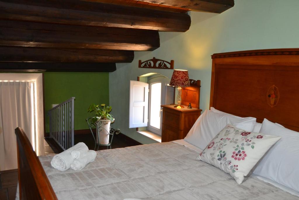 Postel nebo postele na pokoji v ubytování SUD room Palazzo Rau della Ferla