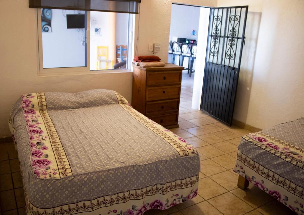 En eller flere senge i et værelse på C1 casa en la peñita 10 personas con alberca