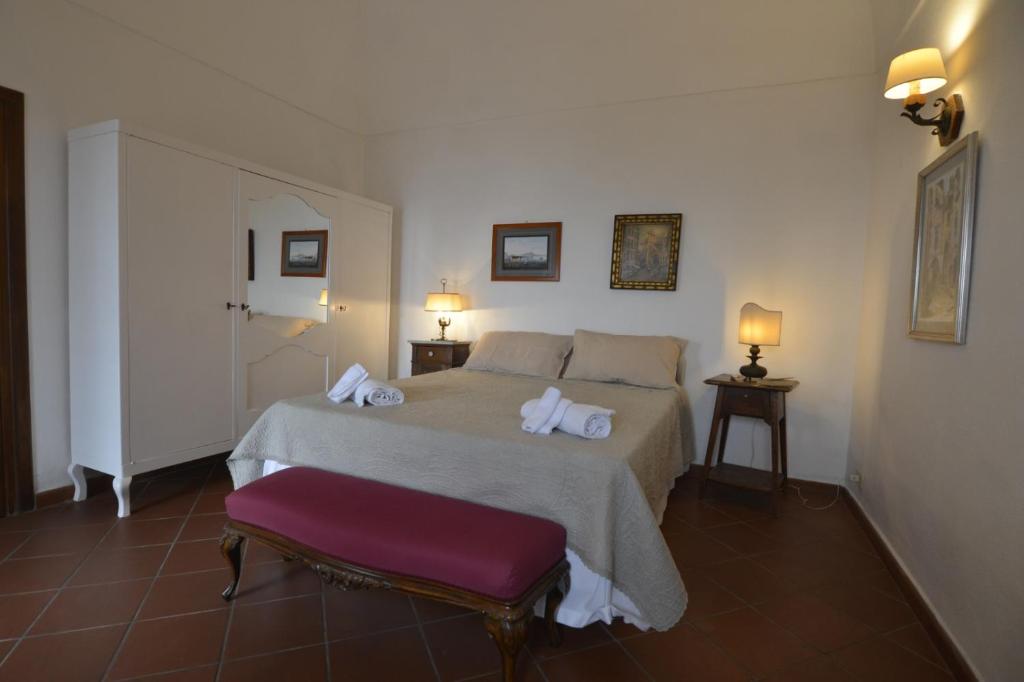 A bed or beds in a room at Villino Prota, villa ridente con panorama mozzafiato