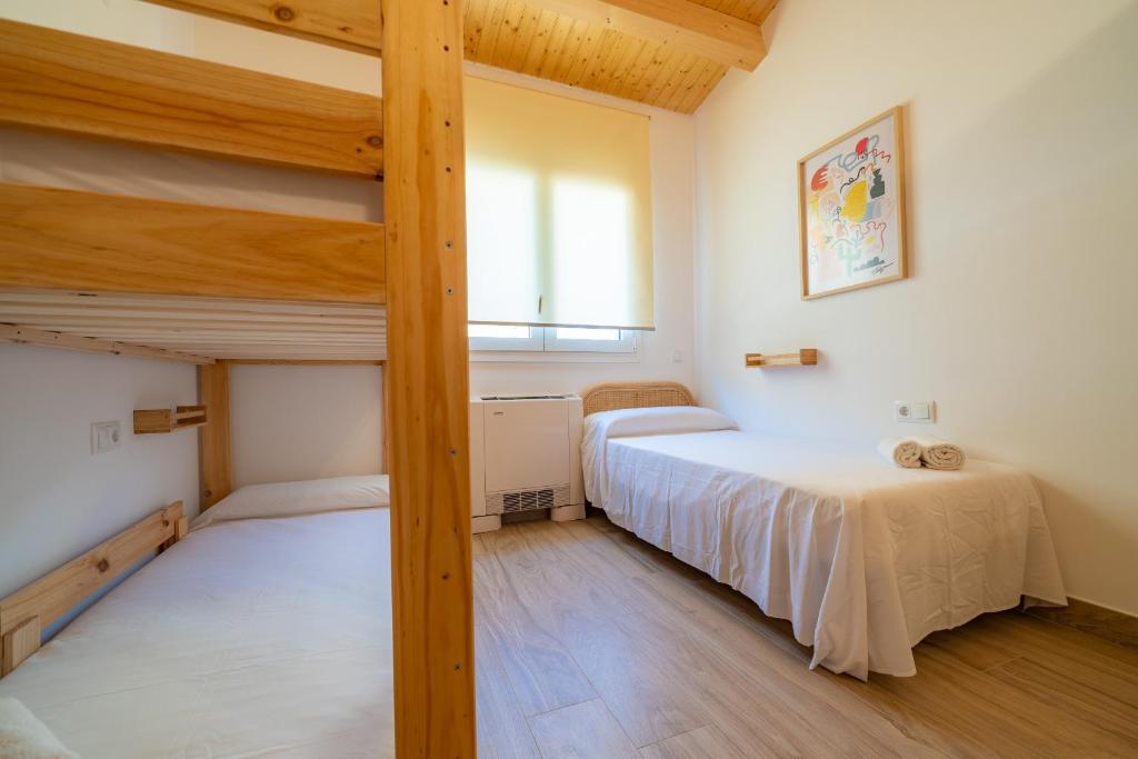 Posteľ alebo postele v izbe v ubytovaní HomeHolidaysRentals Benoit - Costa Barcelona
