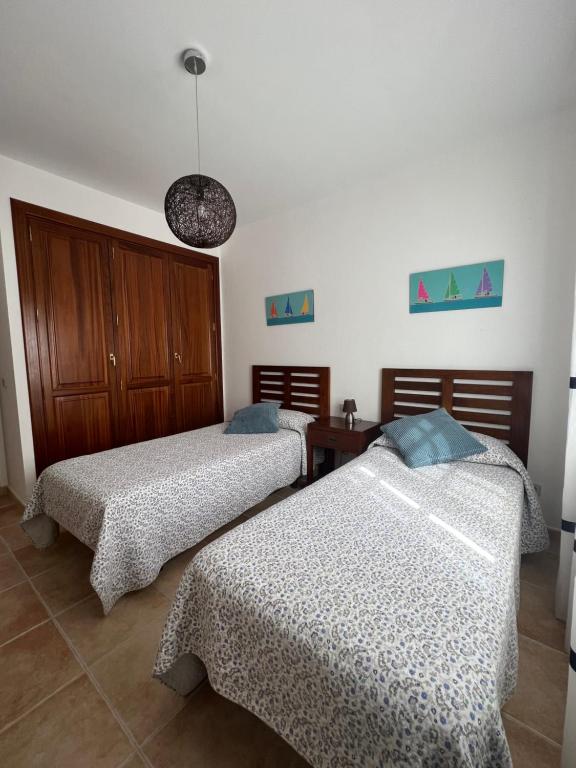 Postel nebo postele na pokoji v ubytování CasadeLanzarote